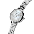 Angled close-up of the pale mottled dial and silver-tone case beside the silver-tone link bracelet.