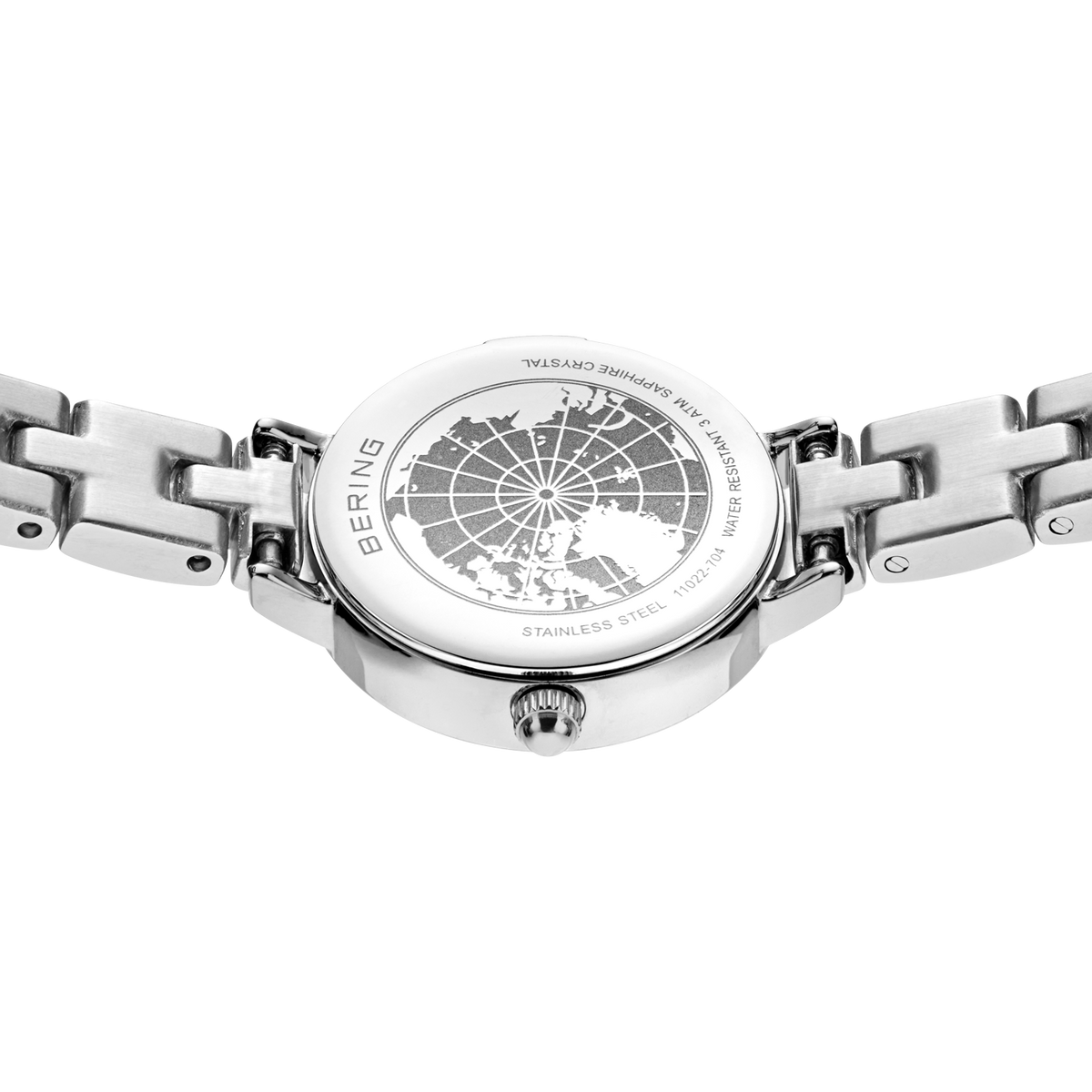 Engraved watch case back with the silver-tone link bracelet extended to either side.