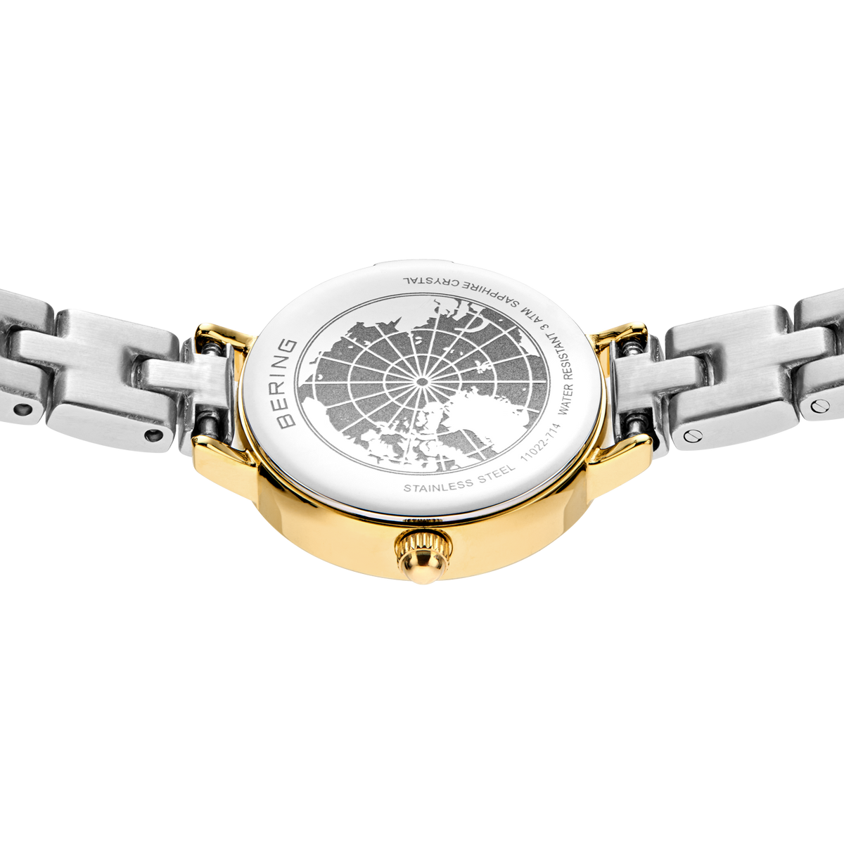Engraved watch case back with the silver- and gold-tone link bracelet extended to either side.