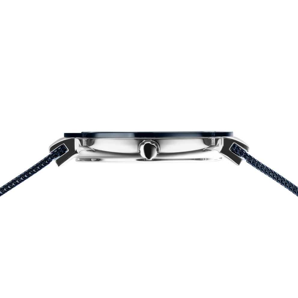 Side profile of the silver-tone with blue bezel watch case and crown between the ends of the blue mesh strap.