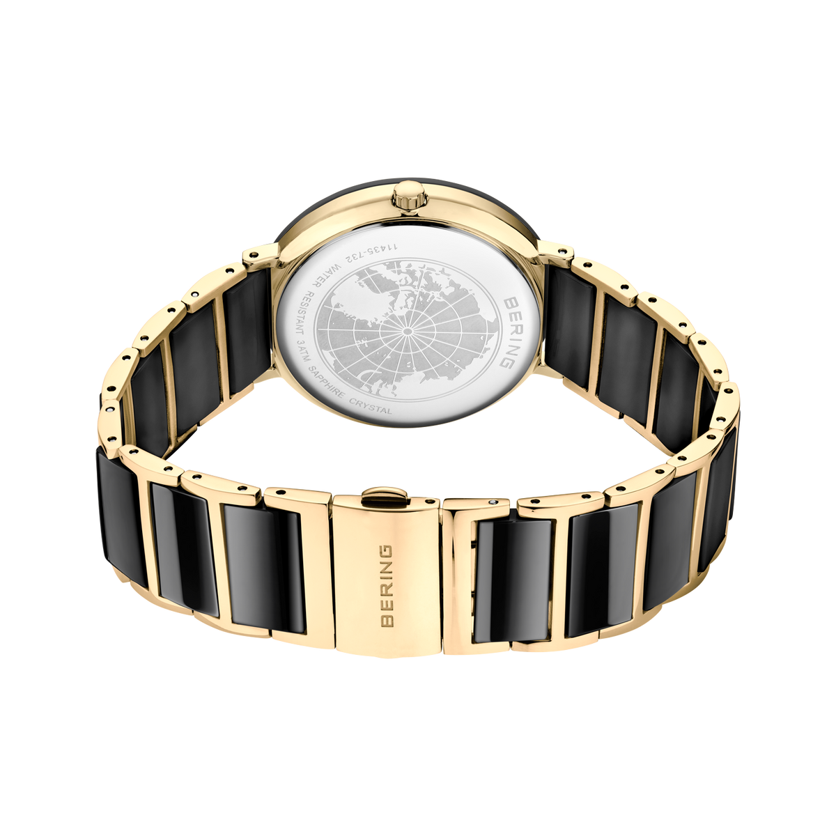Vista posterior del reloj, con pulsera dorada de eslabones con centros negros formando un aro y cierre cerrado.