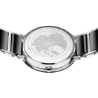 Engraved watch case back with the black-centered silver-tone link bracelet extended to either side.
