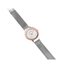 Diagonal overhead view of the pale dial with bright dot markers, oval rose-tone case and silver-tone mesh strap.