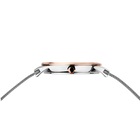 Side profile of the oval rose-tone watch case and crown between the ends of the silver-tone mesh strap.