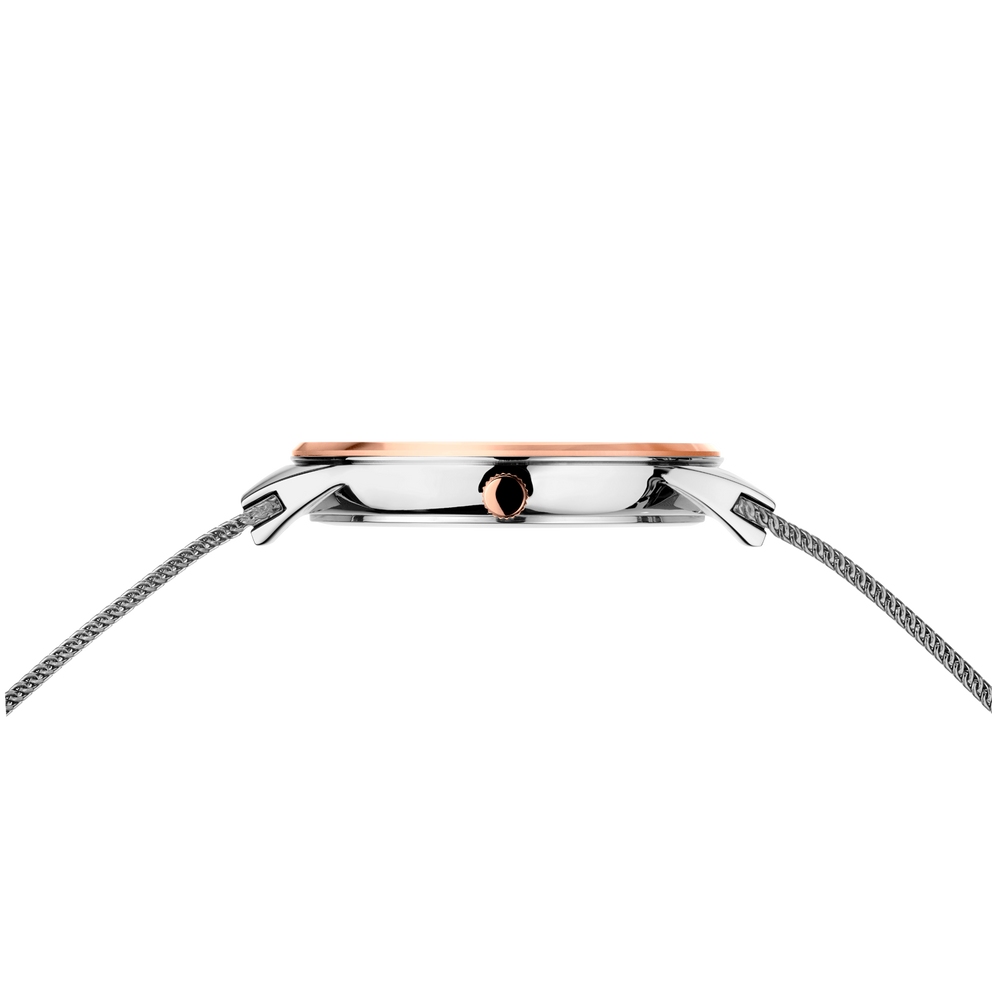 Side profile of the oval rose-tone watch case and crown between the ends of the silver-tone mesh strap.