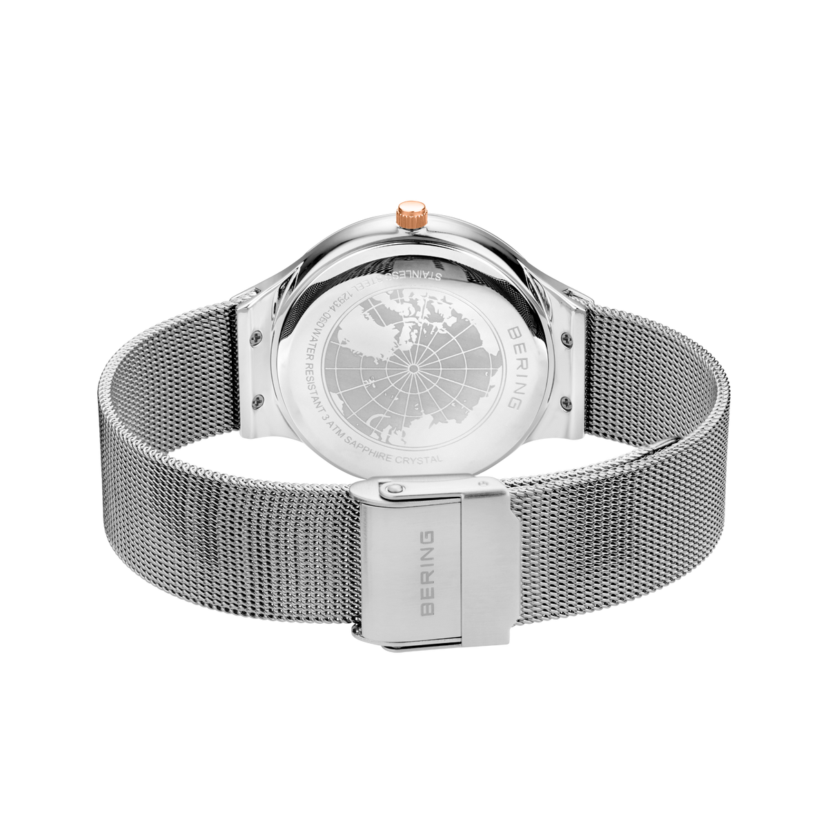 Rear view of the watch with its silver-tone mesh strap looped and fastener closed.