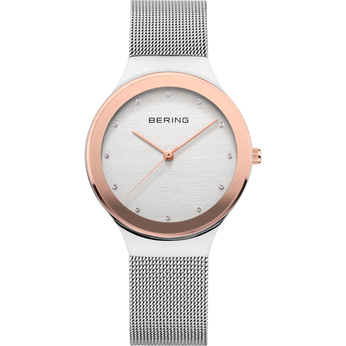 Front view: pale dial with bright dot markers, oval rose-tone case and silver-tone mesh strap.