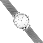 Diagonal overhead view of the white dial, silver-tone case and silver-tone mesh strap.