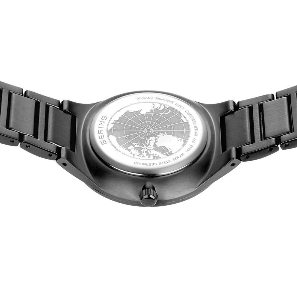 Engraved watch case back with the grey link bracelet extended to either side.