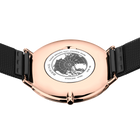 Engraved watch case back with the black mesh strap extended to either side.
