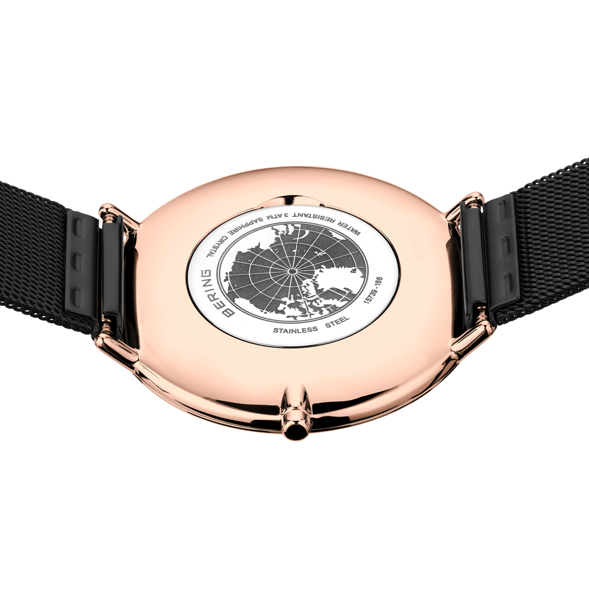 Engraved watch case back with the black mesh strap extended to either side.