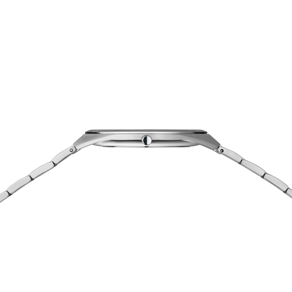 Side profile of the silver-tone watch case and crown between the ends of the silver-tone link bracelet.