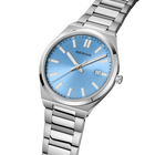 Angled close-up of the light blue dial and silver-tone case beside the silver-tone link bracelet.