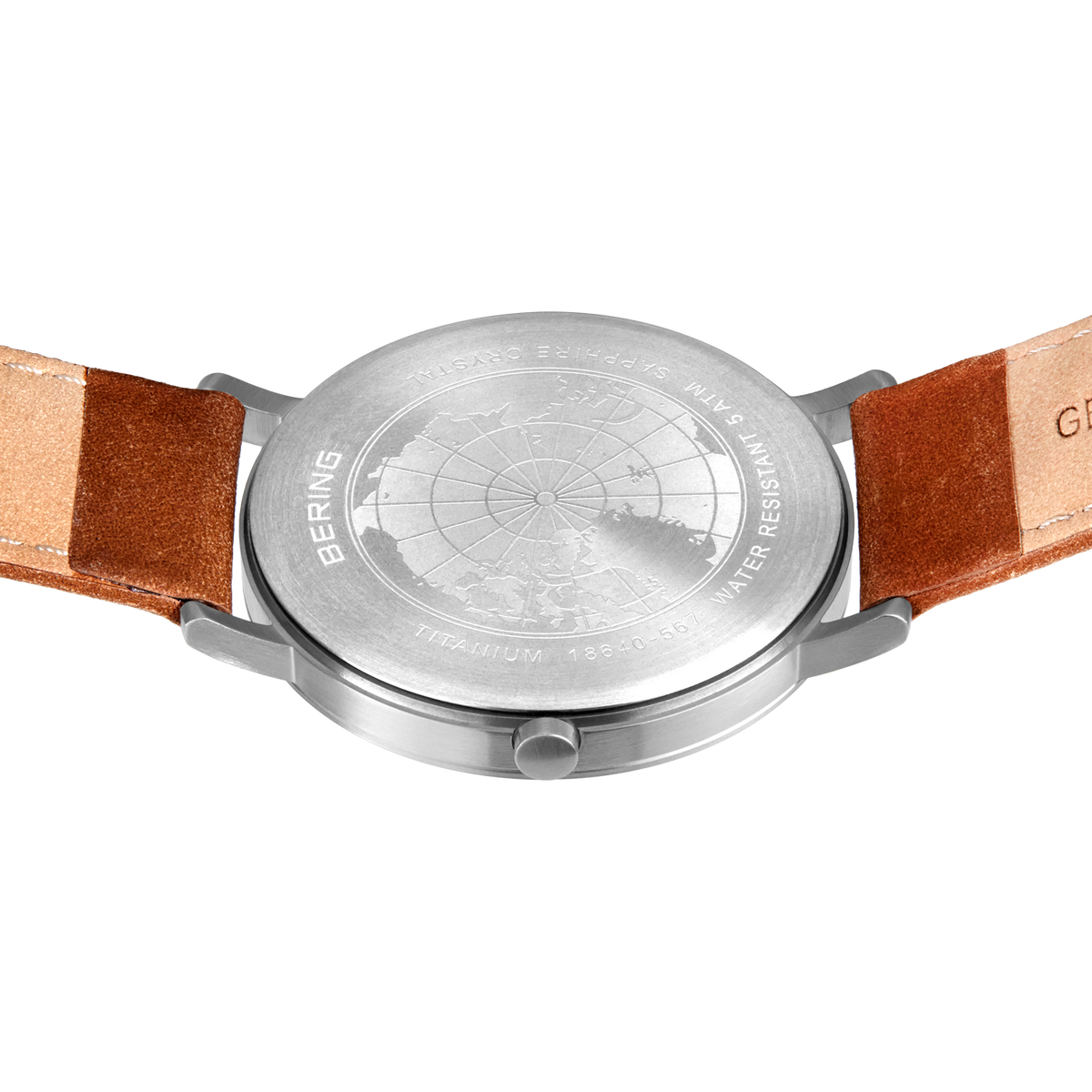 Engraved watch case back with the stitched brown strap extended to either side.