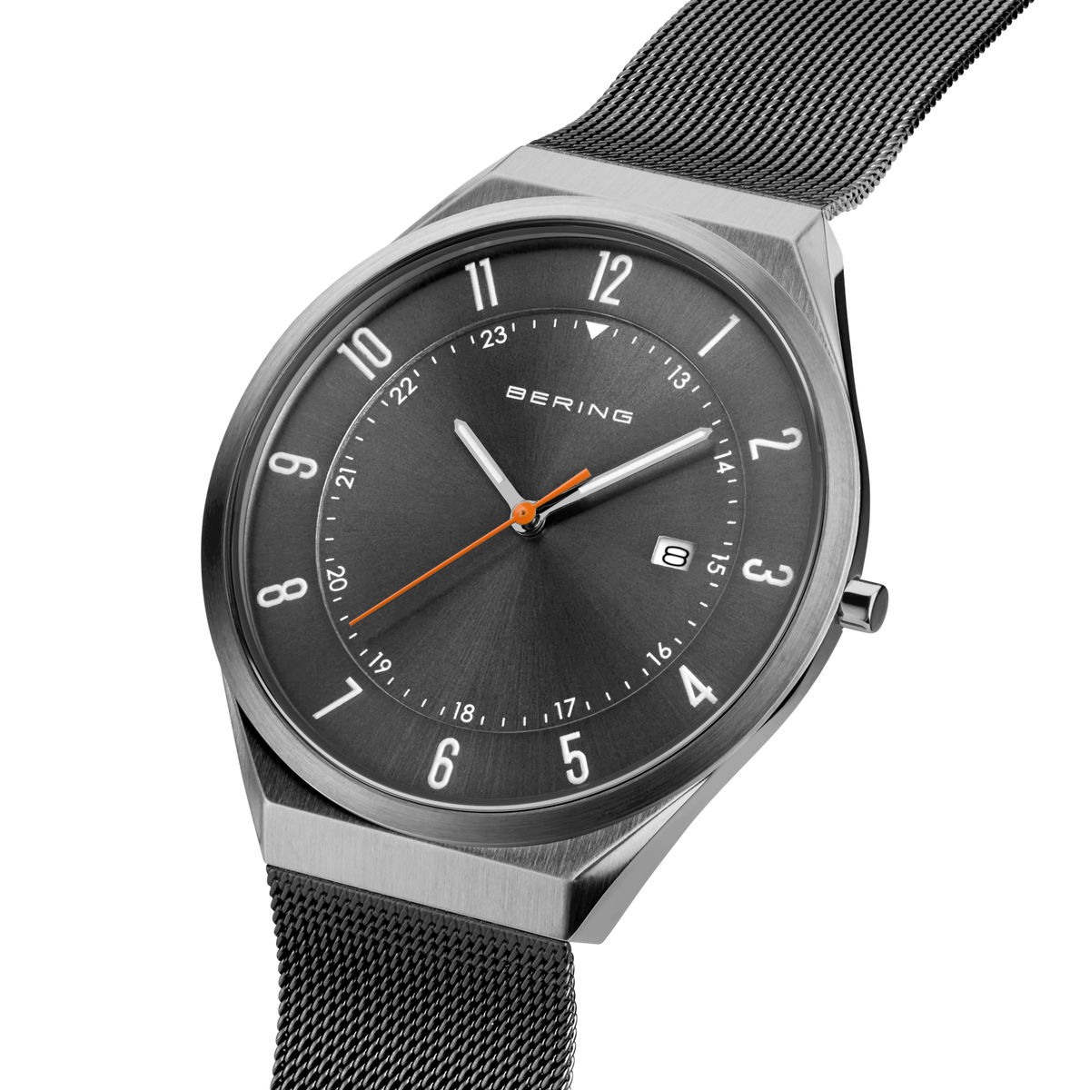 Angled close-up of the grey dial with an orange hand and grey case beside the grey mesh strap.