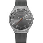 Front view: grey dial with an orange hand, grey case and grey mesh strap.
